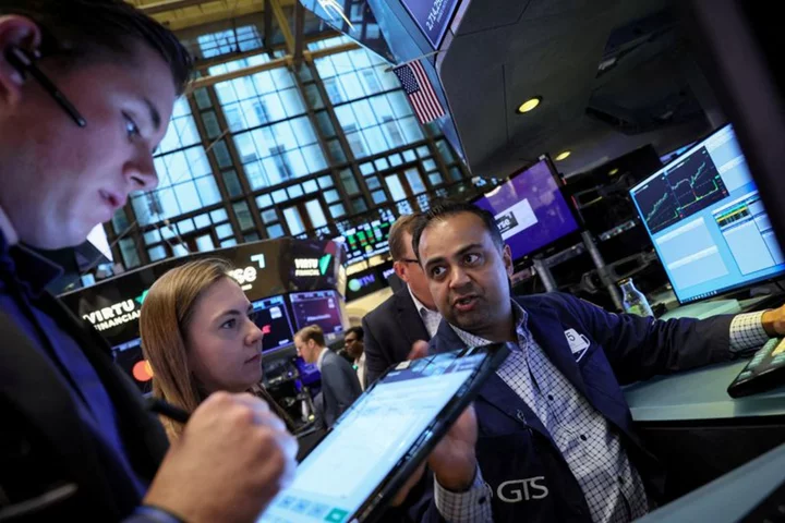 Wall St set for lower open as investors await more earnings